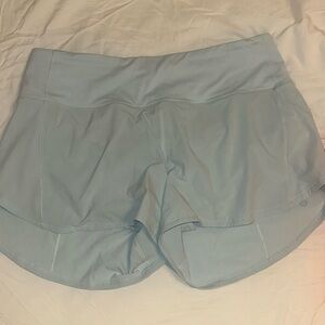 Lululemon high rise speed up shorts 4 inch. size 10. powder blue color